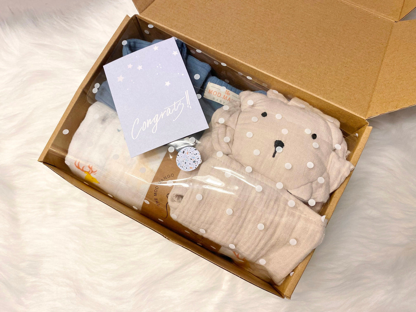 neutral baby boy gift, newborn boy gift set, gift baby boy, hedgehog swaddle blanket, tan taupe brown ivory ribbed knit long sleeve bodysuit with knot hat, muslin swaddle organic cotton gift set baby boy, lion lovey comforter blanket