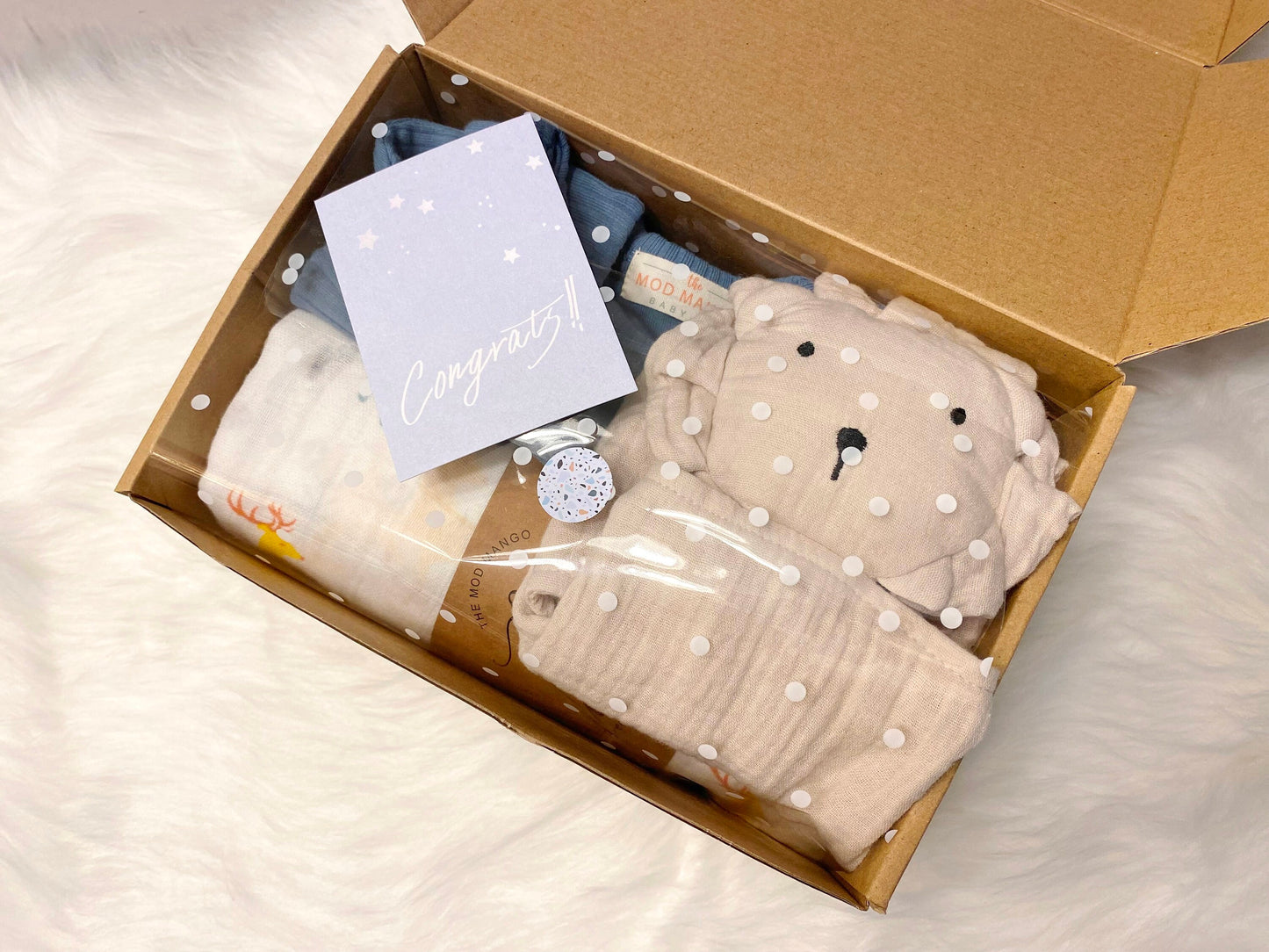 neutral baby boy gift, newborn boy gift set, gift baby boy, hedgehog swaddle blanket, tan taupe brown ivory ribbed knit long sleeve bodysuit with knot hat, muslin swaddle organic cotton gift set baby boy, lion lovey comforter blanket