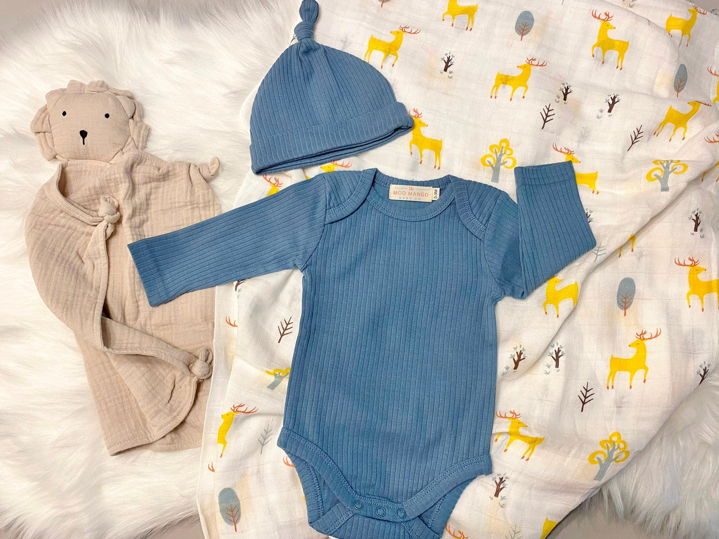 blue deer baby boy gift, newborn boy gift set, gift baby boy, deer swaddle blanket, ribbed knit long sleeve bodysuit with knot hat, muslin swaddle organic cotton gift set baby boy, lion lovey comforter blanket, blue deer hunting baby boy