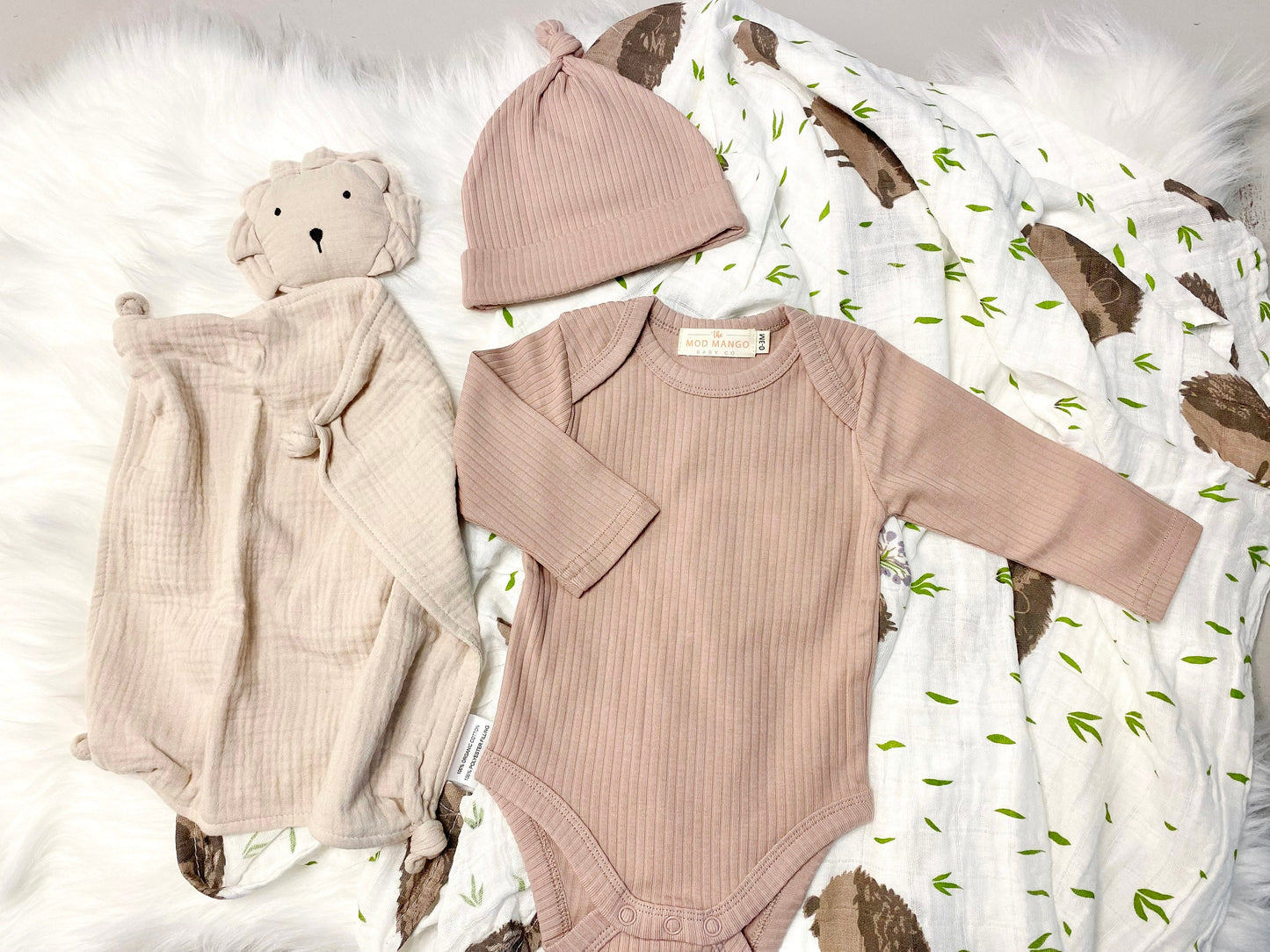 neutral baby boy gift, newborn boy gift set, gift baby boy, hedgehog swaddle blanket, tan taupe brown ivory ribbed knit long sleeve bodysuit with knot hat, muslin swaddle organic cotton gift set baby boy, lion lovey comforter blanket
