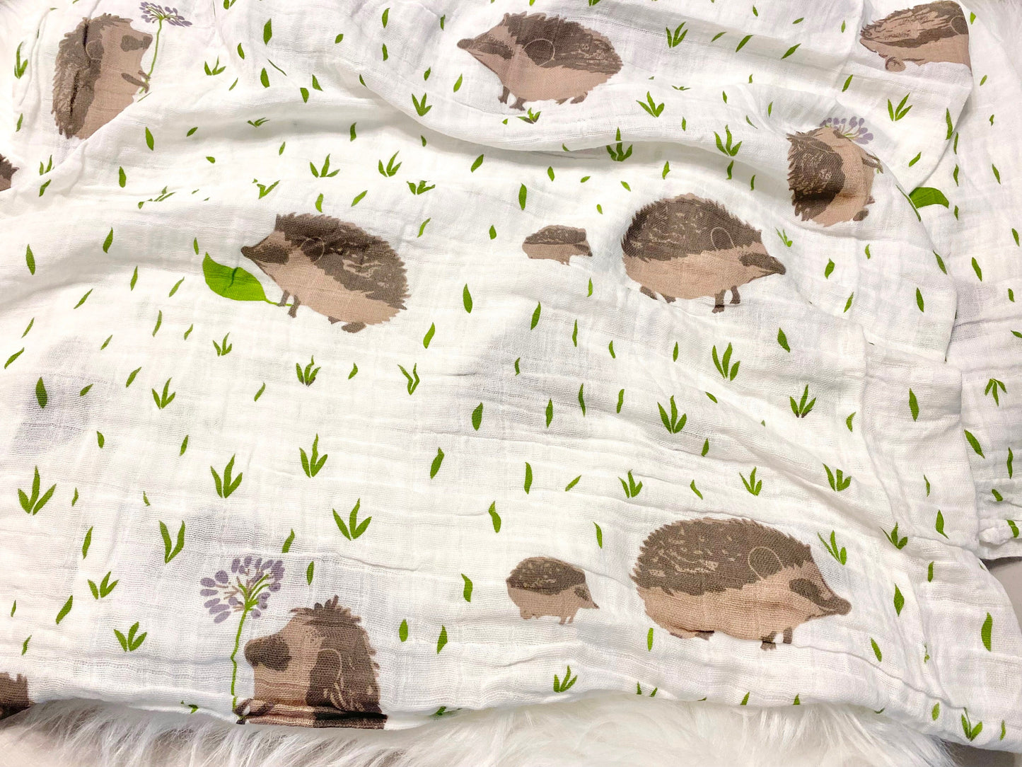 neutral baby boy gift, newborn boy gift set, gift baby boy, hedgehog swaddle blanket, tan taupe brown ivory ribbed knit long sleeve bodysuit with knot hat, muslin swaddle organic cotton gift set baby boy, lion lovey comforter blanket