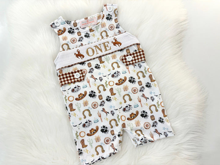 my first rodeo birthday boy romper cowboy western shortalls brown tan beige white gingham smash cake outfit overalls, ONE smocked romper first birthday cowboy, rodeo western cowboy embroidered smocked spring summer fall 1st birthday boy outfit romper baby boys rodeo 1st birthday