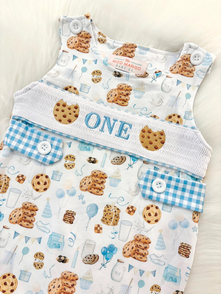 milk and cookies birthday boy romper sweet one cookies shortalls brown tan blue white gingham smash cake outfit overalls, ONE smocked romper first birthday cookies, milk and cookies embroidered smocked spring summer fall 1st birthday boy outfit romper baby boys sweets 1st birthday