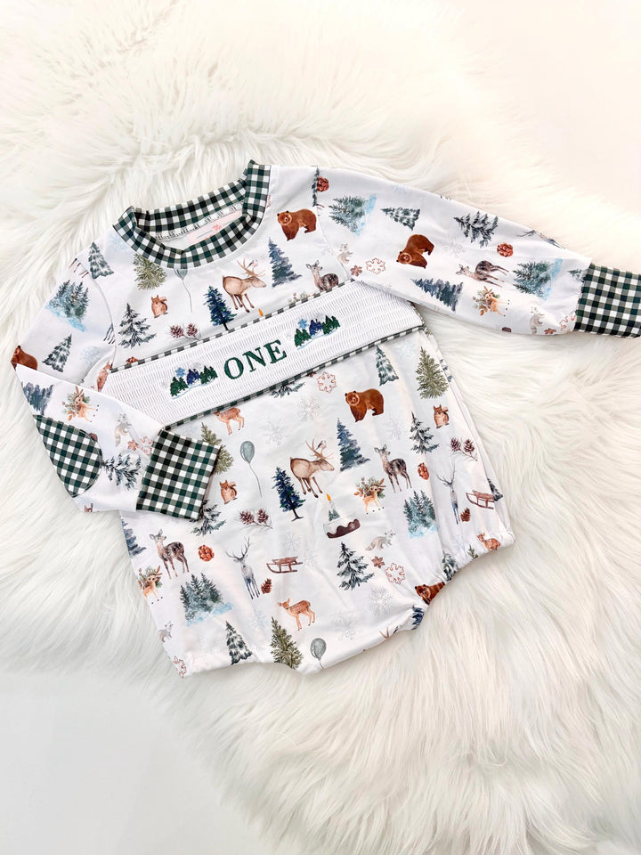 Christmas winter onederland wonderland shirt first birthday boy romper holiday blue brown hunter green white gingham checkered outfit, ONE smocked bubble romper first birthday bear pine trees deer woodland animals, snowflake and pine trees embroidered smocked 1st birthday outfit romper baby boys, the mod mango baby co baby boutique