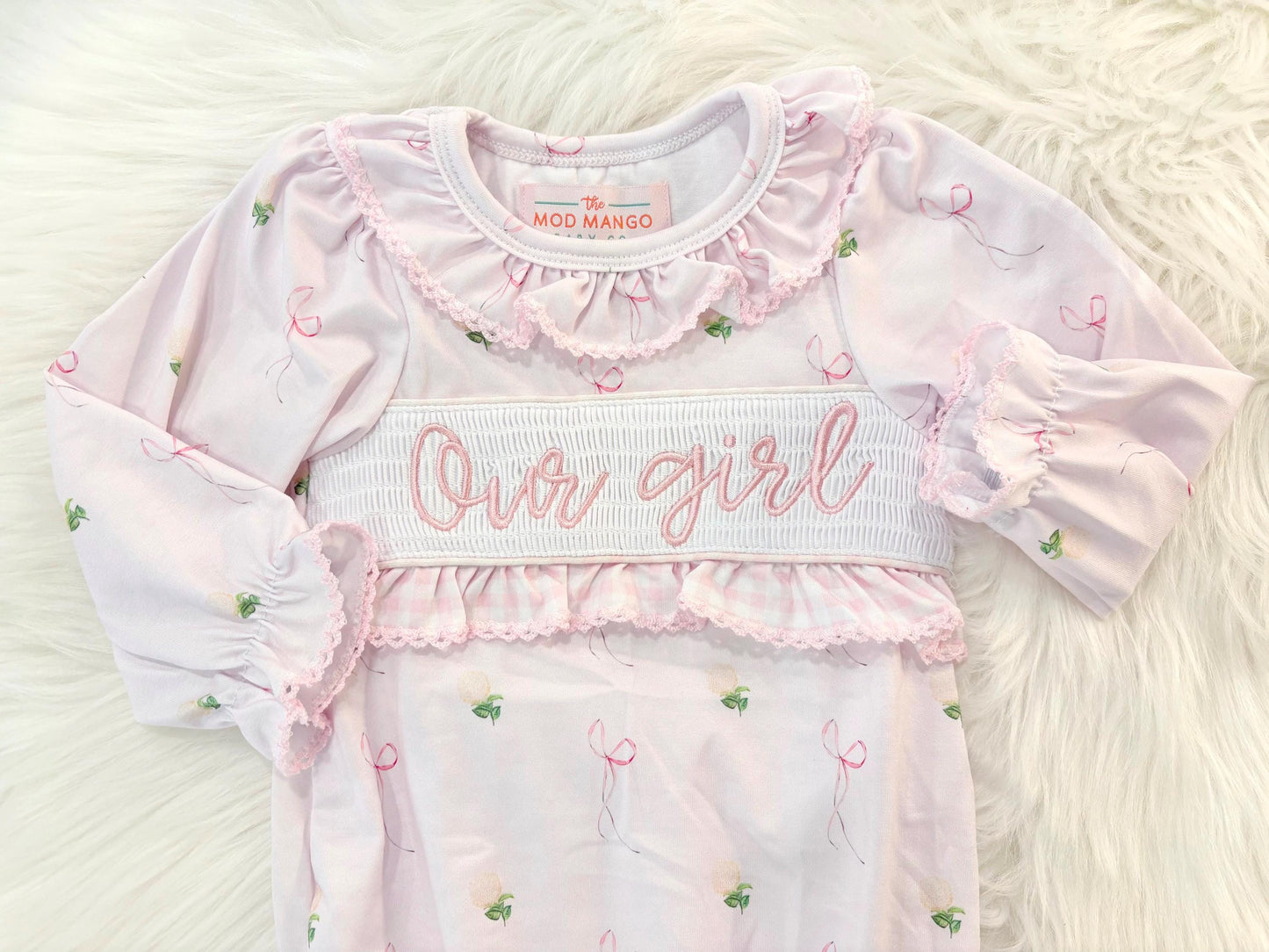 newborn girls pink and white baby gown with flowers for baby girl, our girl monogram baby shower gift for girl, light pink gingham baby gift, newborn coming home outfit, baby shower gift set, pregnancy announcement, custom newborn baby gown, boutique smocked baby gift set, the mod mango baby boutique co