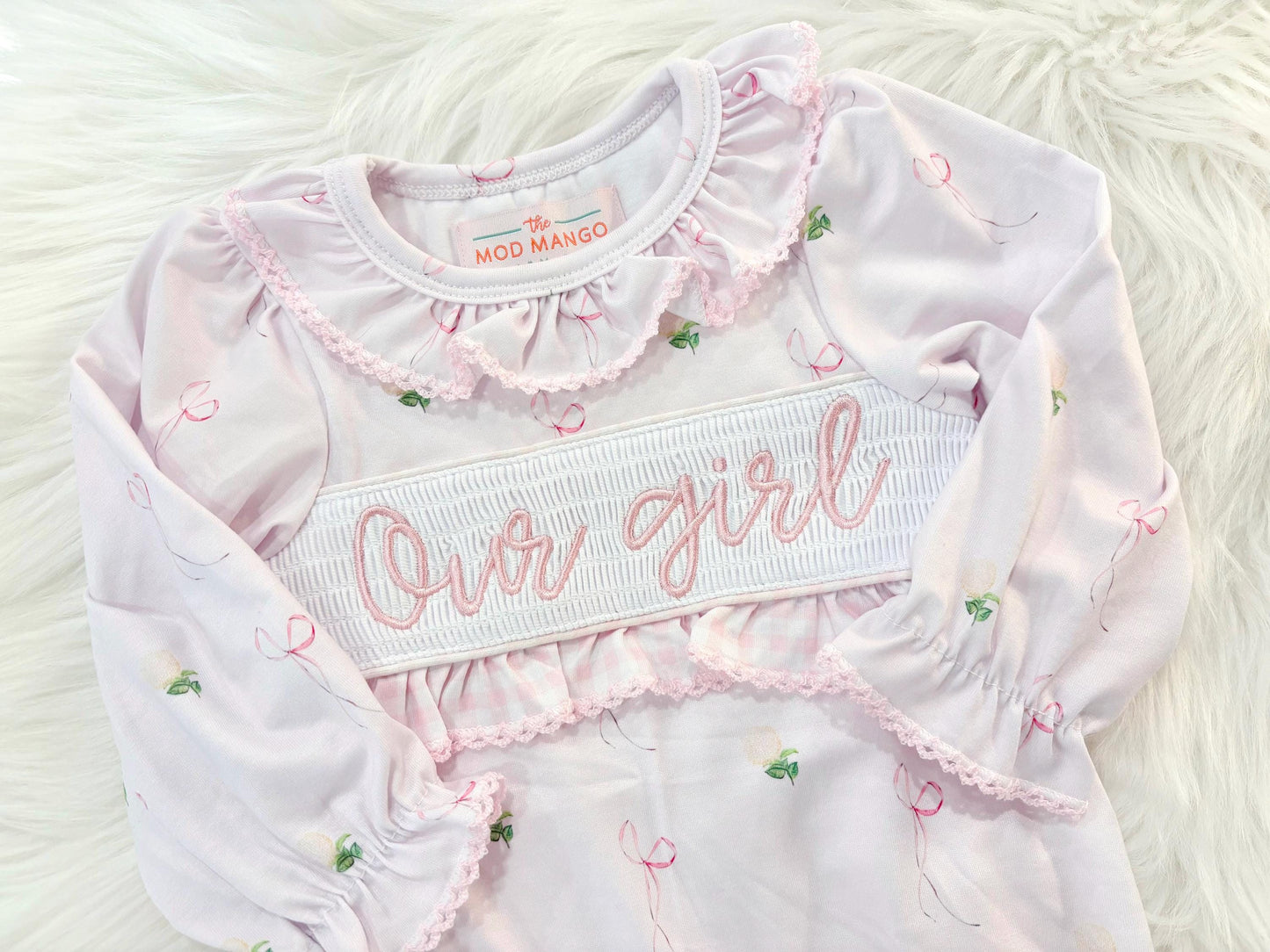 newborn girls pink and white baby gown with flowers for baby girl, our girl monogram baby shower gift for girl, light pink gingham baby gift, newborn coming home outfit, baby shower gift set, pregnancy announcement, custom newborn baby gown, boutique smocked baby gift set, the mod mango baby boutique co