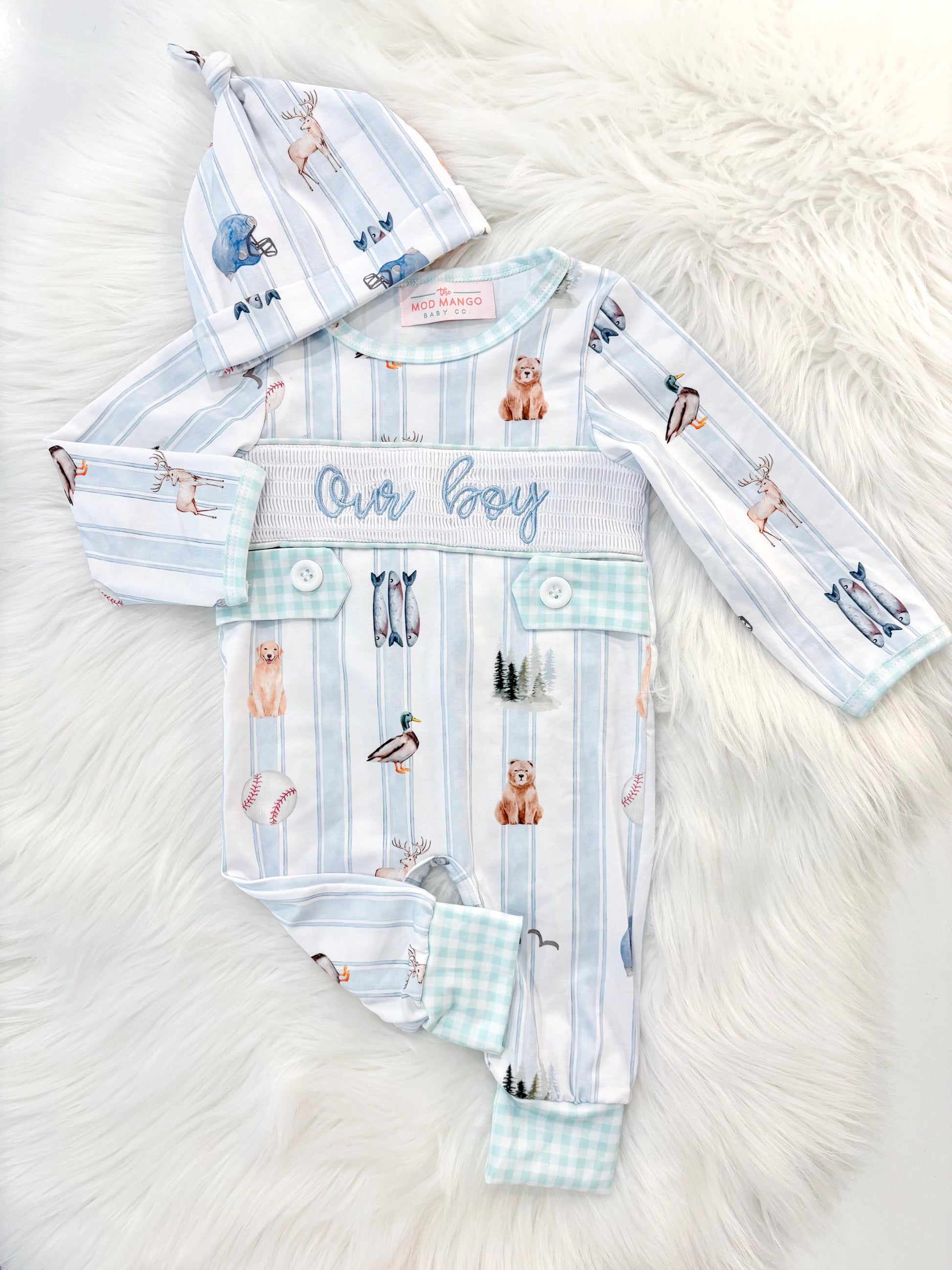 newborn boys baby blue and white smocked baby romper outfit bodysuit and knotted hat with stripes and boy hunting for baby, fish buck deer bear football sports baseball mallard duck puppy dog pine trees outdoor all american boy, our boy monogram baby shower gift for boy, light blue and mint green gingham baby gift, newborn coming home outfit, baby shower gift set, pregnancy announcement, custom newborn baby romper outfit, boutique smocked baby gift set, the mod mango baby boutique co
