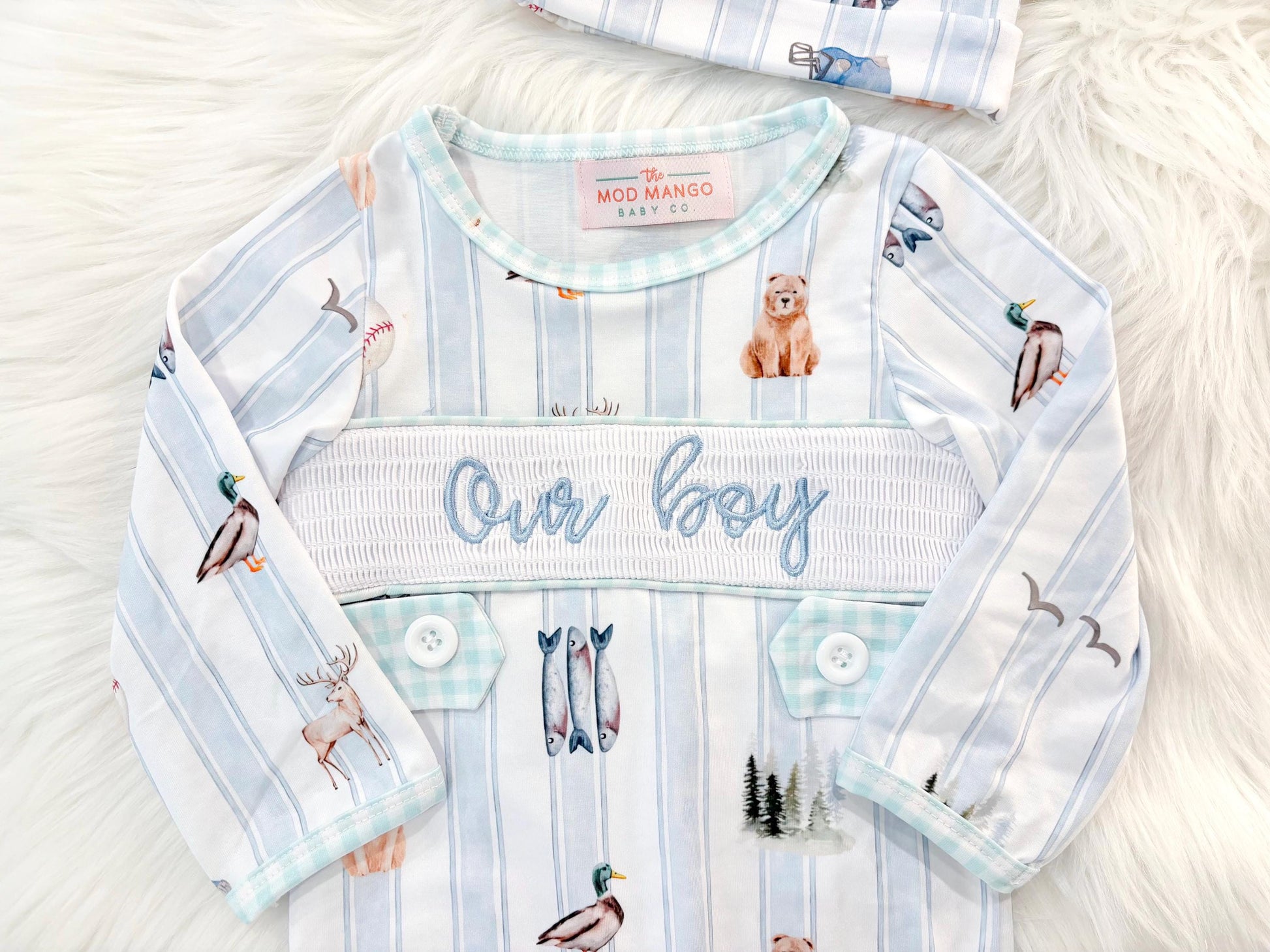 newborn boys baby blue and white smocked baby romper outfit bodysuit and knotted hat with stripes and boy hunting for baby, fish buck deer bear football sports baseball mallard duck puppy dog pine trees outdoor all american boy, our boy monogram baby shower gift for boy, light blue and mint green gingham baby gift, newborn coming home outfit, baby shower gift set, pregnancy announcement, custom newborn baby romper outfit, boutique smocked baby gift set, the mod mango baby boutique co