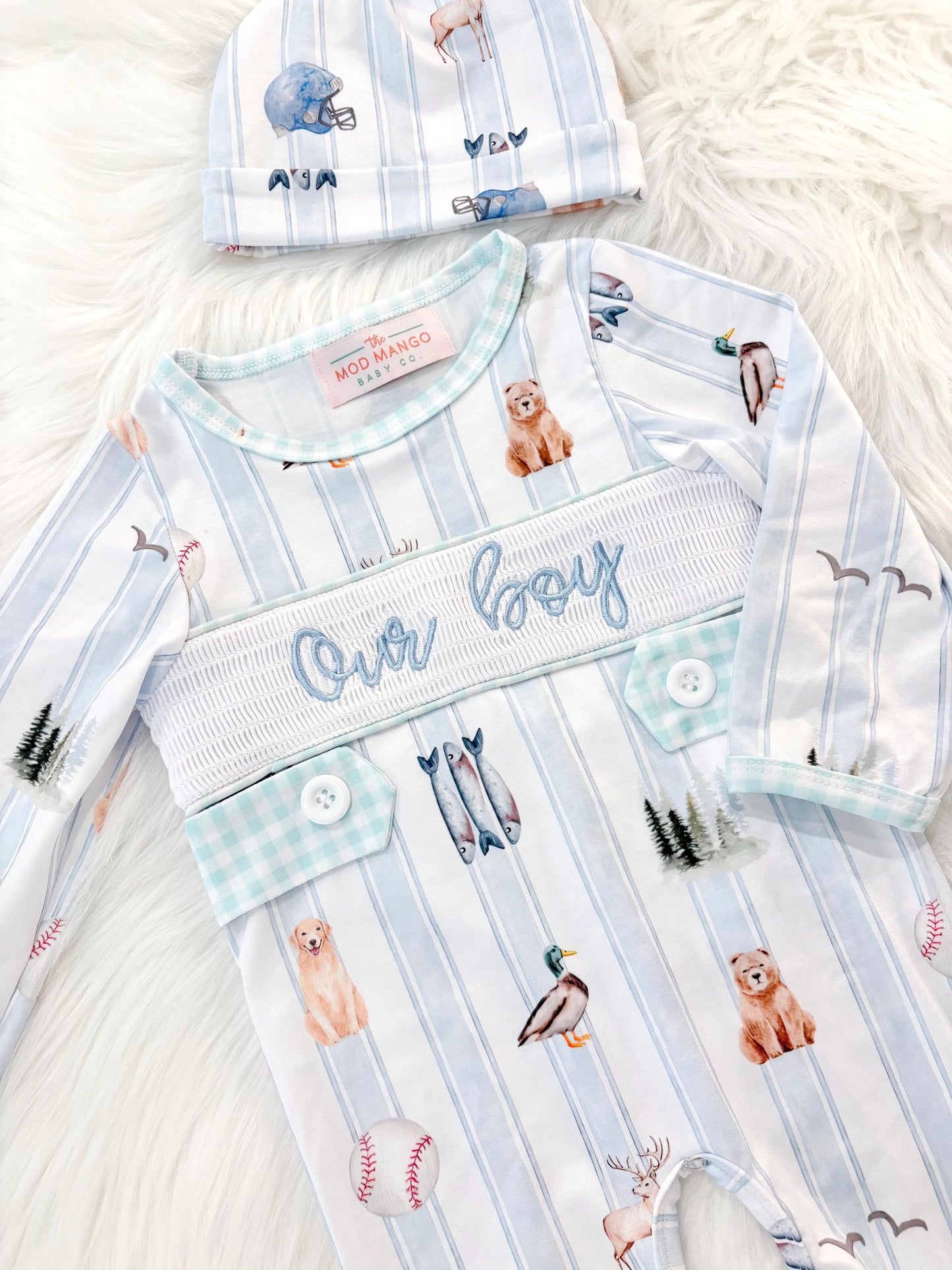newborn boys baby blue and white smocked baby romper outfit bodysuit and knotted hat with stripes and boy hunting for baby, fish buck deer bear football sports baseball mallard duck puppy dog pine trees outdoor all american boy, our boy monogram baby shower gift for boy, light blue and mint green gingham baby gift, newborn coming home outfit, baby shower gift set, pregnancy announcement, custom newborn baby romper outfit, boutique smocked baby gift set, the mod mango baby boutique co