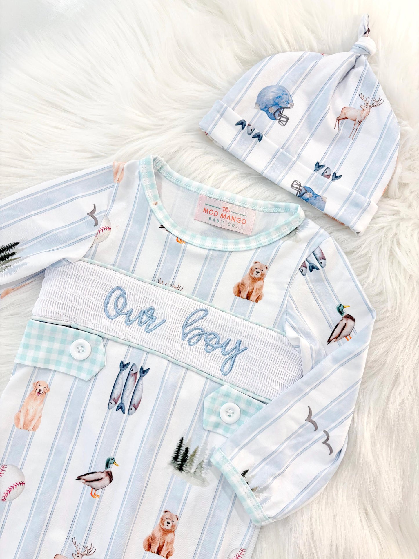 newborn boys baby blue and white smocked baby romper outfit bodysuit and knotted hat with stripes and boy hunting for baby, fish buck deer bear football sports baseball mallard duck puppy dog pine trees outdoor all american boy, our boy monogram baby shower gift for boy, light blue and mint green gingham baby gift, newborn coming home outfit, baby shower gift set, pregnancy announcement, custom newborn baby romper outfit, boutique smocked baby gift set, the mod mango baby boutique co