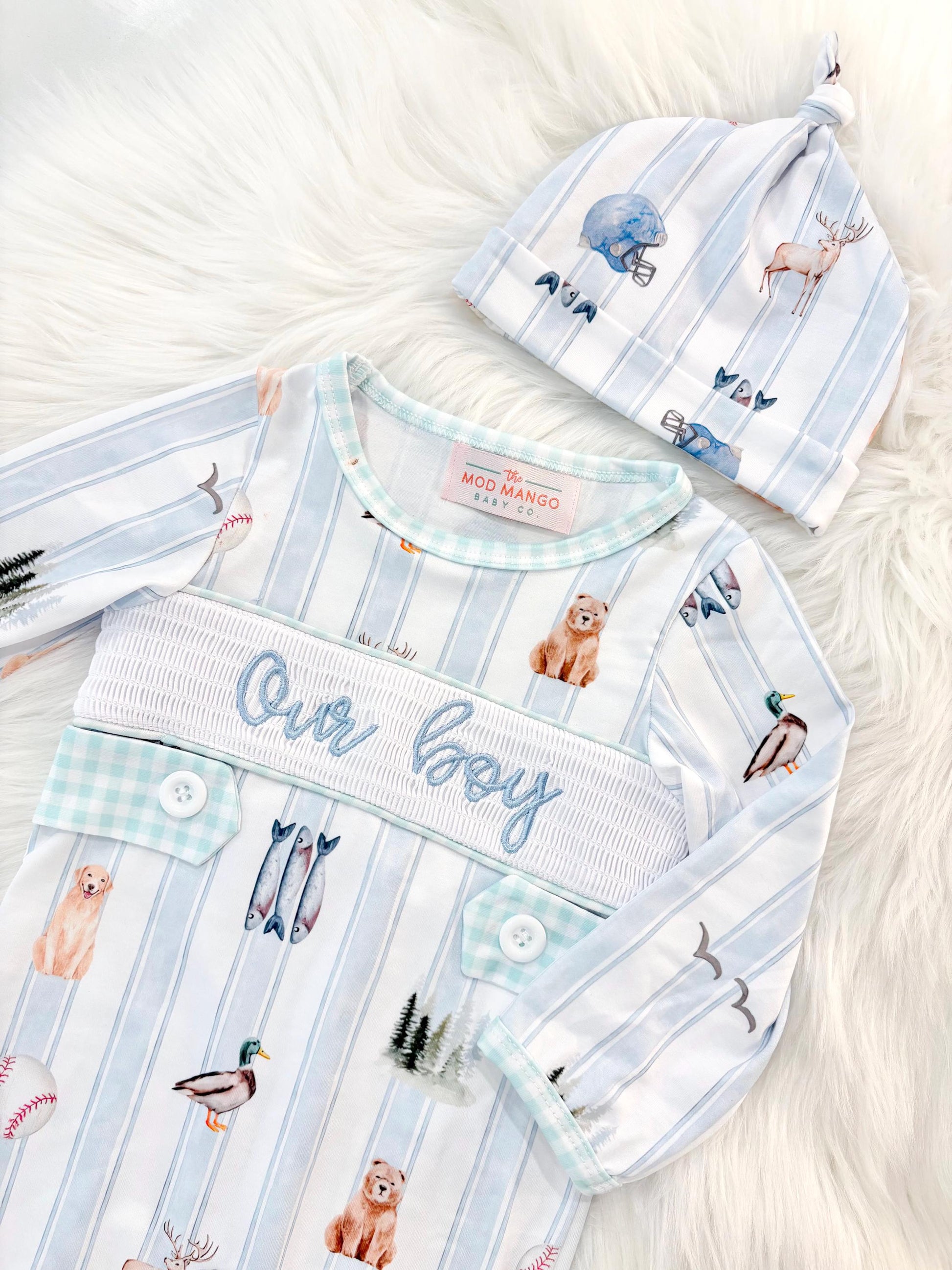 newborn boys baby blue and white smocked baby romper outfit bodysuit and knotted hat with stripes and boy hunting for baby, fish buck deer bear football sports baseball mallard duck puppy dog pine trees outdoor all american boy, our boy monogram baby shower gift for boy, light blue and mint green gingham baby gift, newborn coming home outfit, baby shower gift set, pregnancy announcement, custom newborn baby romper outfit, boutique smocked baby gift set, the mod mango baby boutique co