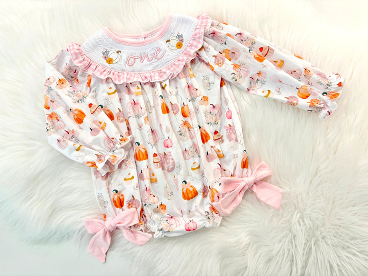 pink pumpkin bow first birthday girl romper blush pink orange floral and white outfit, pink and white gingham smocked bubble romper first birthday fall pumpkins ruffle bows embroidered smocked long sleeve 1st birthday outfit romper baby girls, the mod mango, the mod mango baby co baby boutique