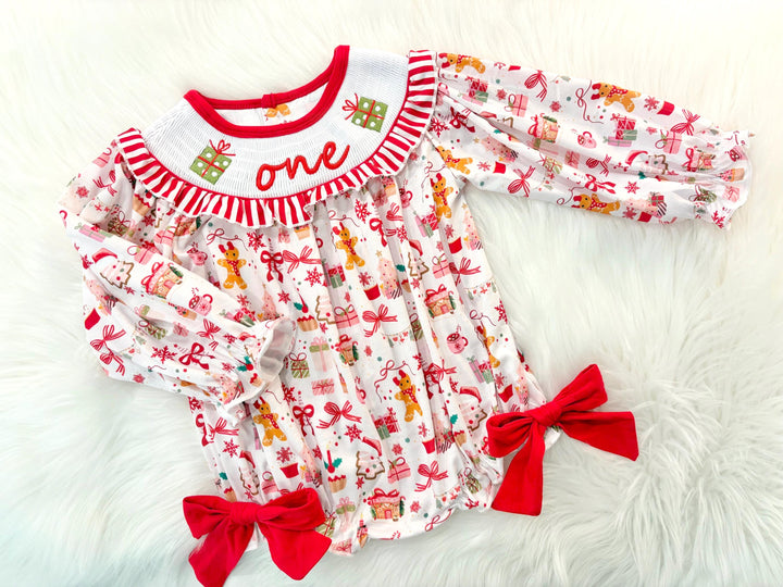 red christmas bow oh what fun it is to be one first birthday girl romper red green white pink outfit, red and white striped stripes ruffle smocked bubble romper first birthday holiday christmas ruffle bows embroidered smocked long sleeve 1st birthday outfit romper baby girls, the mod mango, the mod mango baby co baby boutique