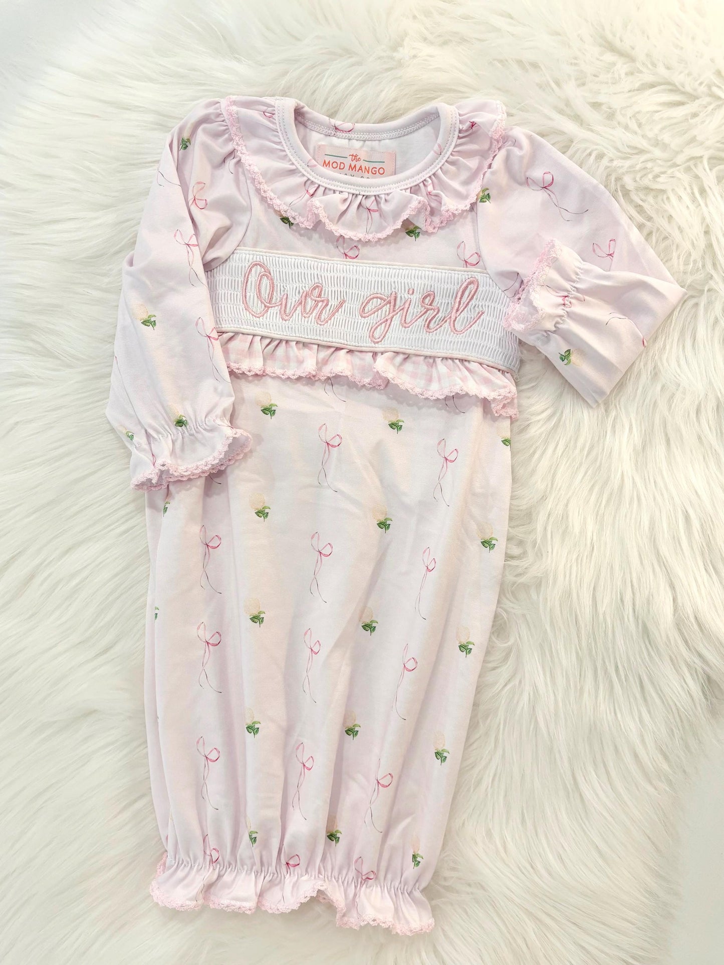 newborn girls pink and white baby gown with flowers for baby girl, our girl monogram baby shower gift for girl, light pink gingham baby gift, newborn coming home outfit, baby shower gift set, pregnancy announcement, custom newborn baby gown, boutique smocked baby gift set, the mod mango baby boutique co