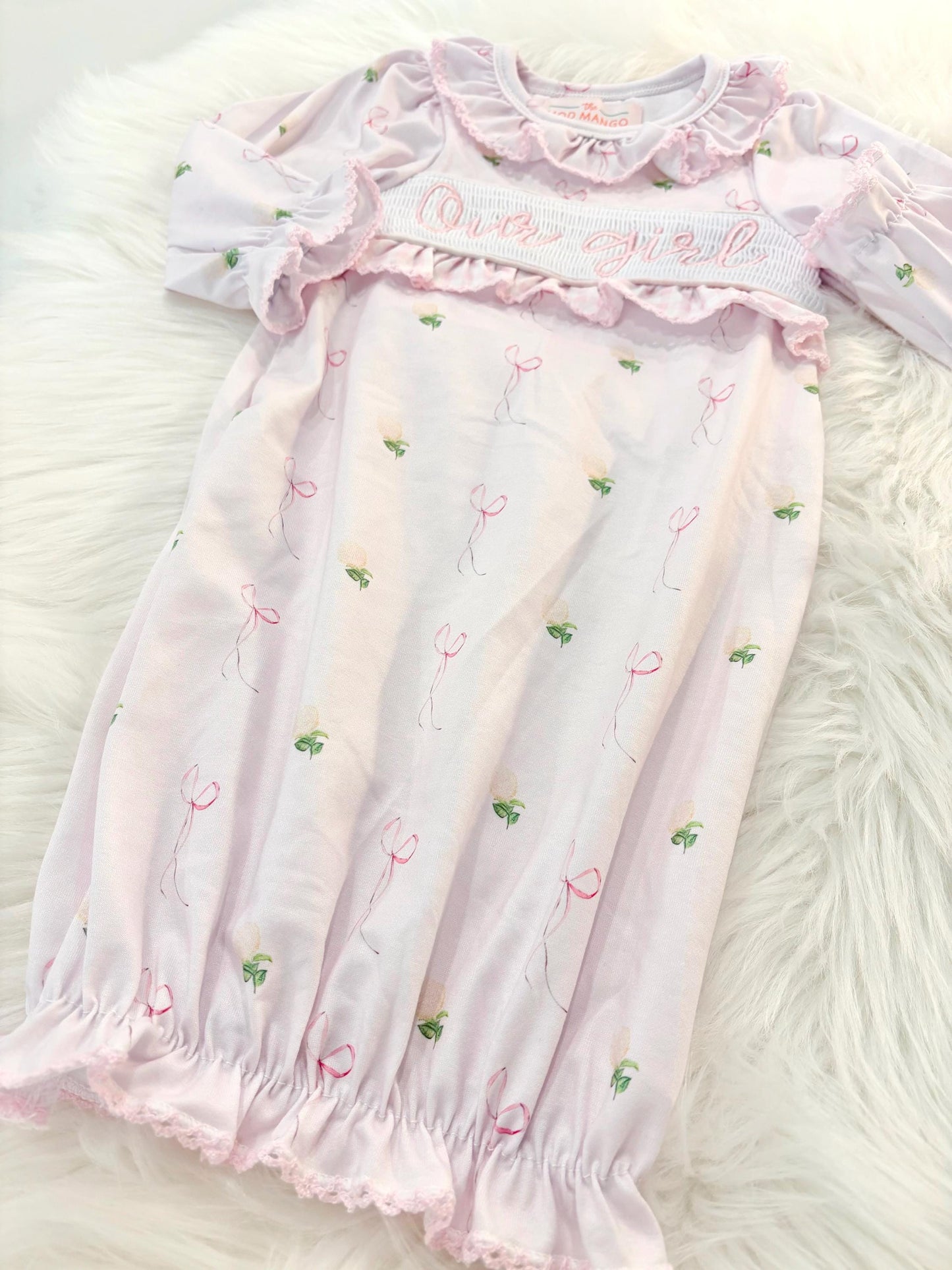 newborn girls pink and white baby gown with flowers for baby girl, our girl monogram baby shower gift for girl, light pink gingham baby gift, newborn coming home outfit, baby shower gift set, pregnancy announcement, custom newborn baby gown, boutique smocked baby gift set, the mod mango baby boutique co