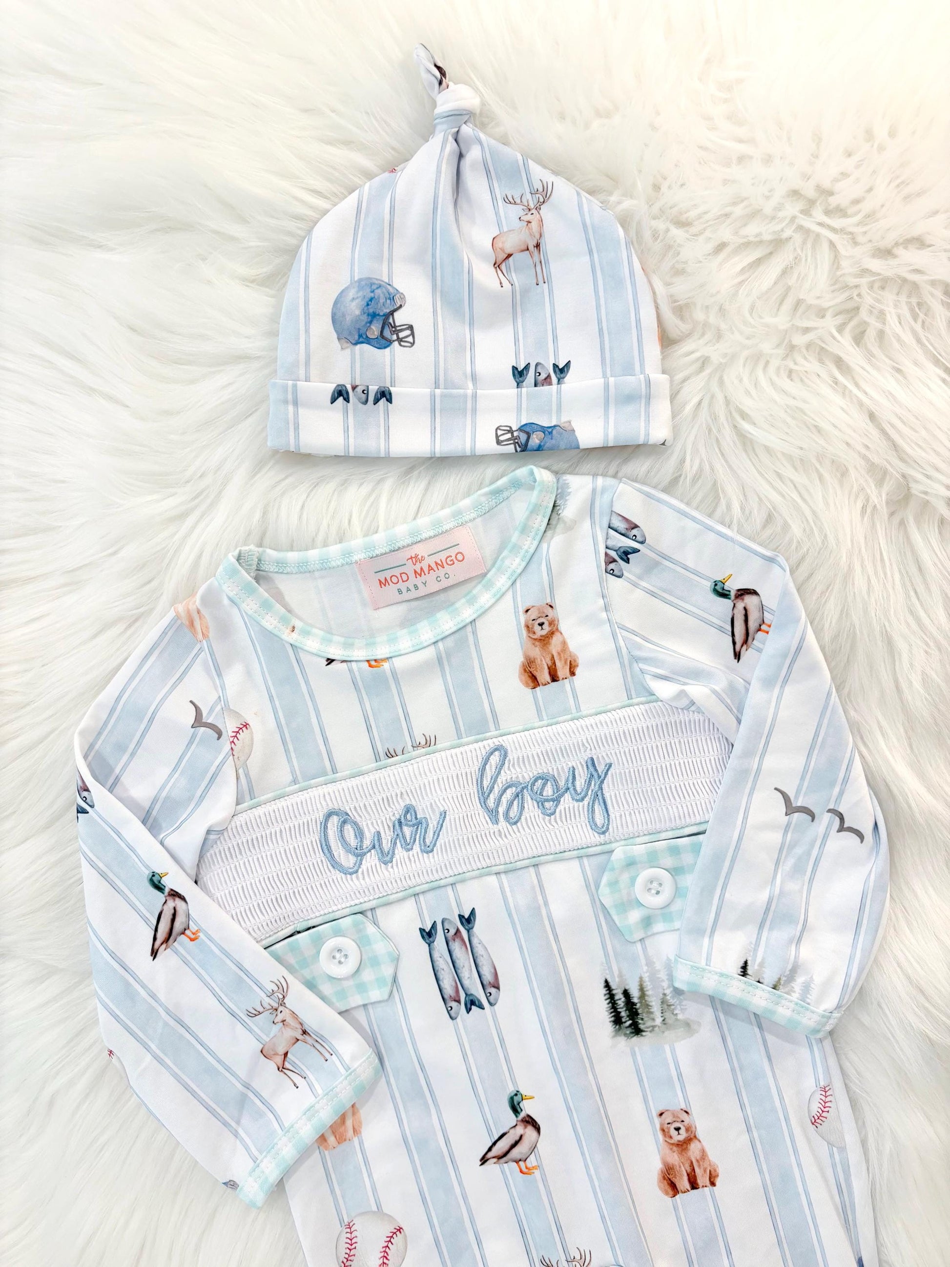 newborn boys baby blue and white smocked baby romper outfit bodysuit and knotted hat with stripes and boy hunting for baby, fish buck deer bear football sports baseball mallard duck puppy dog pine trees outdoor all american boy, our boy monogram baby shower gift for boy, light blue and mint green gingham baby gift, newborn coming home outfit, baby shower gift set, pregnancy announcement, custom newborn baby romper outfit, boutique smocked baby gift set, the mod mango baby boutique co