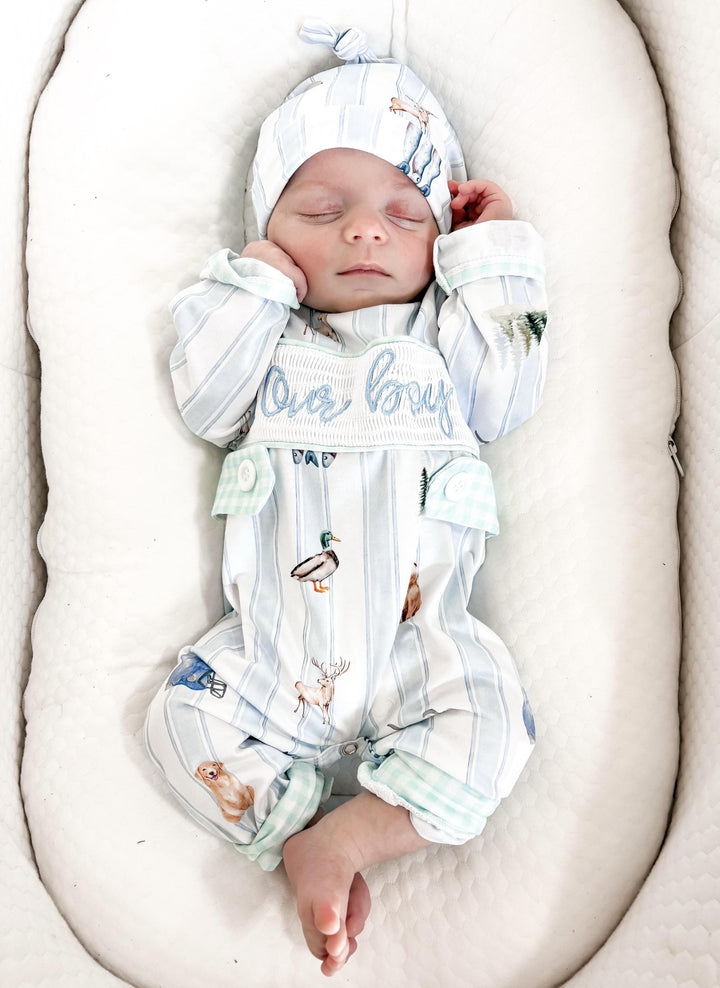 preppy newborn boys baby blue and white smocked baby romper outfit bodysuit and knotted hat with stripes and boy hunting for baby, fish buck deer bear football sports baseball mallard duck puppy dog pine trees outdoor all american boy, our boy monogram baby shower gift for boy, light blue and mint green gingham baby gift, newborn coming home outfit, baby shower gift set, pregnancy announcement, custom newborn baby romper outfit, boutique smocked baby gift set, the mod mango baby boutique co