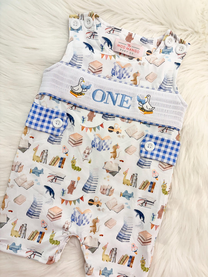 books birthday boy romper one for the books shortalls blue white gingham smash cake outfit overalls, ONE smocked romper first birthday books, storybooks baby goose embroidered smocked spring summer fall 1st birthday boy outfit romper baby boys reading 1st birthday, the mod mango baby co