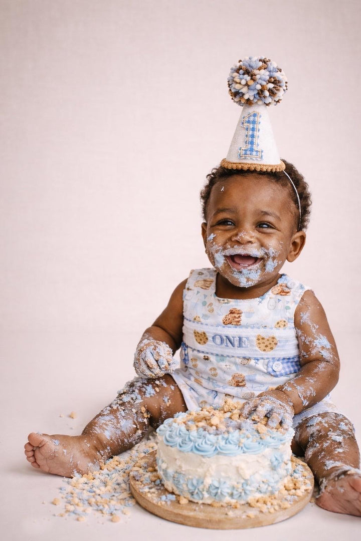 one sweet cookie first birthday milk and cookies birthday boy romper sweet one cookies shortalls brown tan blue white gingham smash cake outfit overalls, ONE smocked romper first birthday cookies, milk and cookies embroidered smocked spring summer fall 1st birthday boy outfit romper baby boys sweets 1st birthday