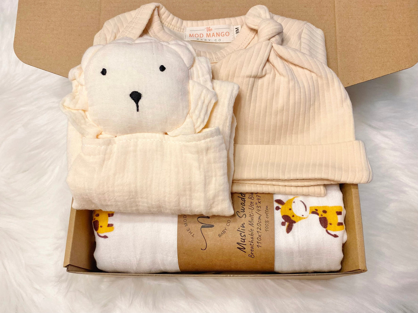 baby boy gift, newborn boy gift set, gift baby boy, giraffe swaddle blanket, neutral cream beige ivory ribbed knit long sleeve bodysuit with knot hat, muslin swaddle organic cotton gift set baby boy, lion lovey comforter blanket,