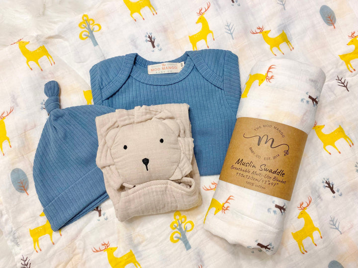 blue deer baby boy gift, newborn boy gift set, gift baby boy, deer swaddle blanket, ribbed knit long sleeve bodysuit with knot hat, muslin swaddle organic cotton gift set baby boy, lion lovey comforter blanket, blue deer hunting baby boy