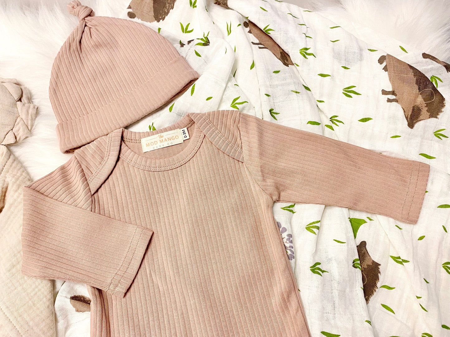 neutral baby boy gift, newborn boy gift set, gift baby boy, hedgehog swaddle blanket, tan taupe brown ivory ribbed knit long sleeve bodysuit with knot hat, muslin swaddle organic cotton gift set baby boy, lion lovey comforter blanket