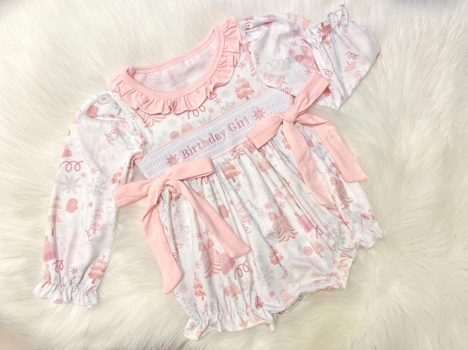 Winter ONEderland Smocked Romper, Pink Snowflake First Birthday Outfit The Mod Mango Baby Co. Winter ONEderland Smocked Romper, Pink Snowflake First Birthday Outfit The Mod Mango Baby Co.