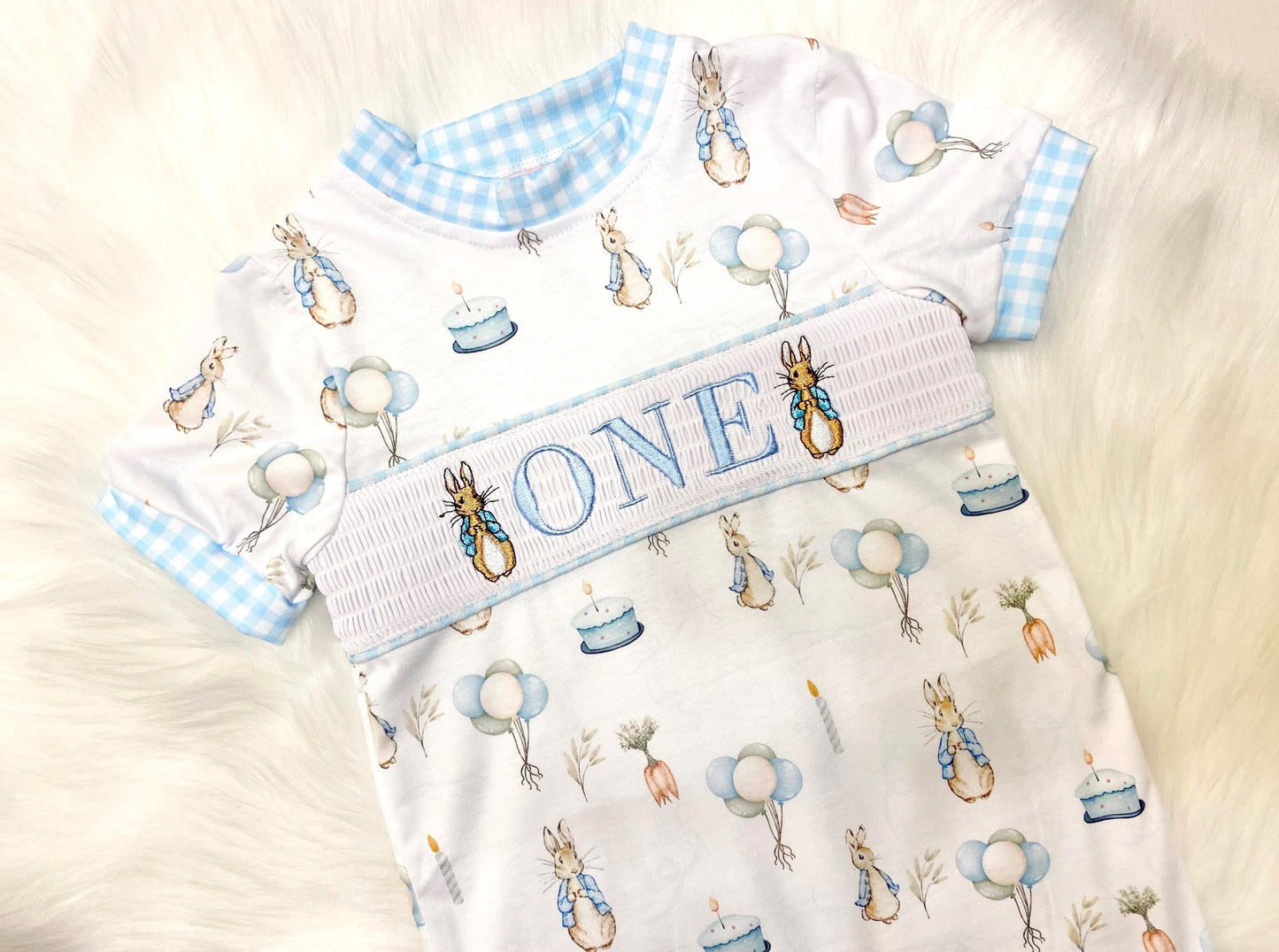 peter rabbit shirt first birthday boy romper spring baby blue and white gingham checkered tan beige outfit, ONE smocked bubble romper first birthday bunny rabbit, some bunny is one embroidered smocked 1st birthday outfit romper baby boys easter
