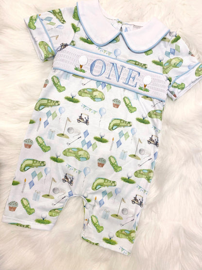hole in one golf outfit shirt first birthday boy romper spring baby blue and white argyle blue green outfit, ONE smocked romper first birthday par tee, golfing golf balls embroidered smocked 1st birthday outfit romper baby boys, the mod mango baby boutique co