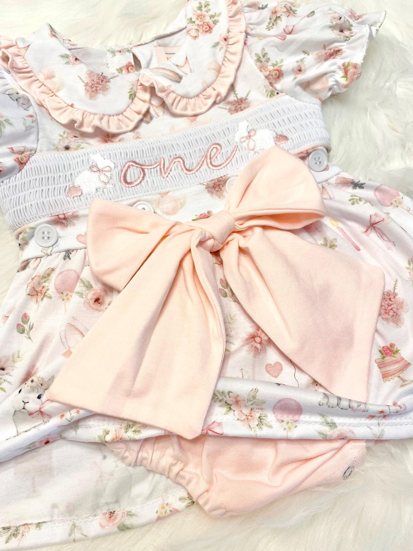 some bunny is one  pink bow first birthday girl romper pink and white outfit, girls one pink white smocked romper dress first birthday spring bunny rabbit easter bow ruffle embroidered smocked short sleeve 1st birthday outfit romper baby girls