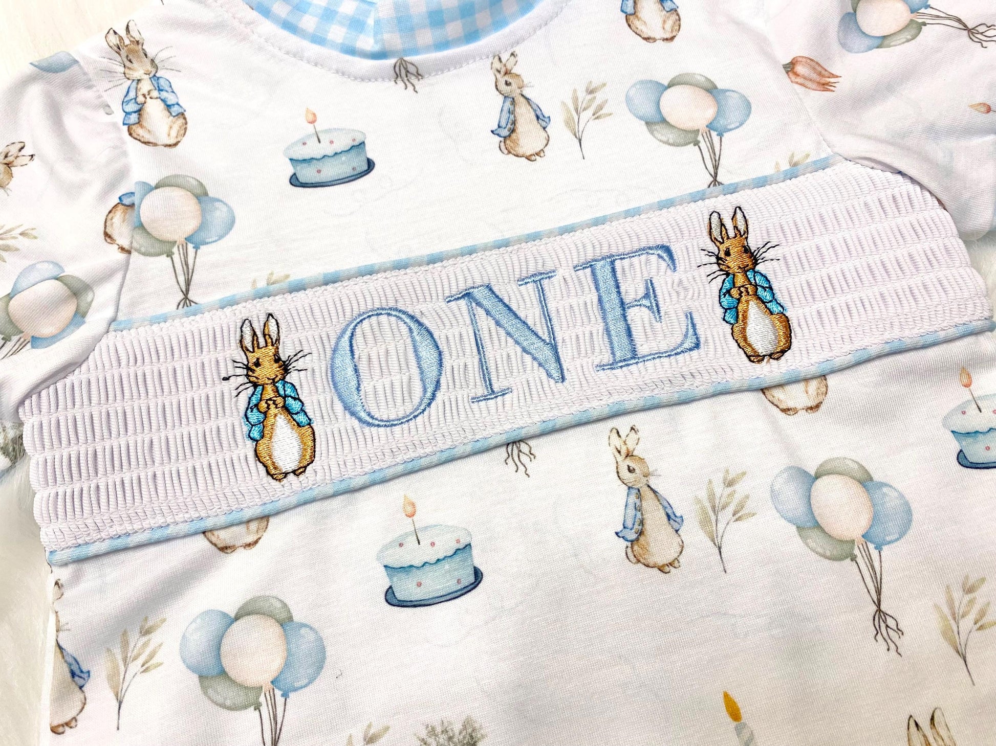 peter rabbit shirt first birthday boy romper spring baby blue and white gingham checkered tan beige outfit, ONE smocked bubble romper first birthday bunny rabbit, some bunny is one embroidered smocked 1st birthday outfit romper baby boys easter