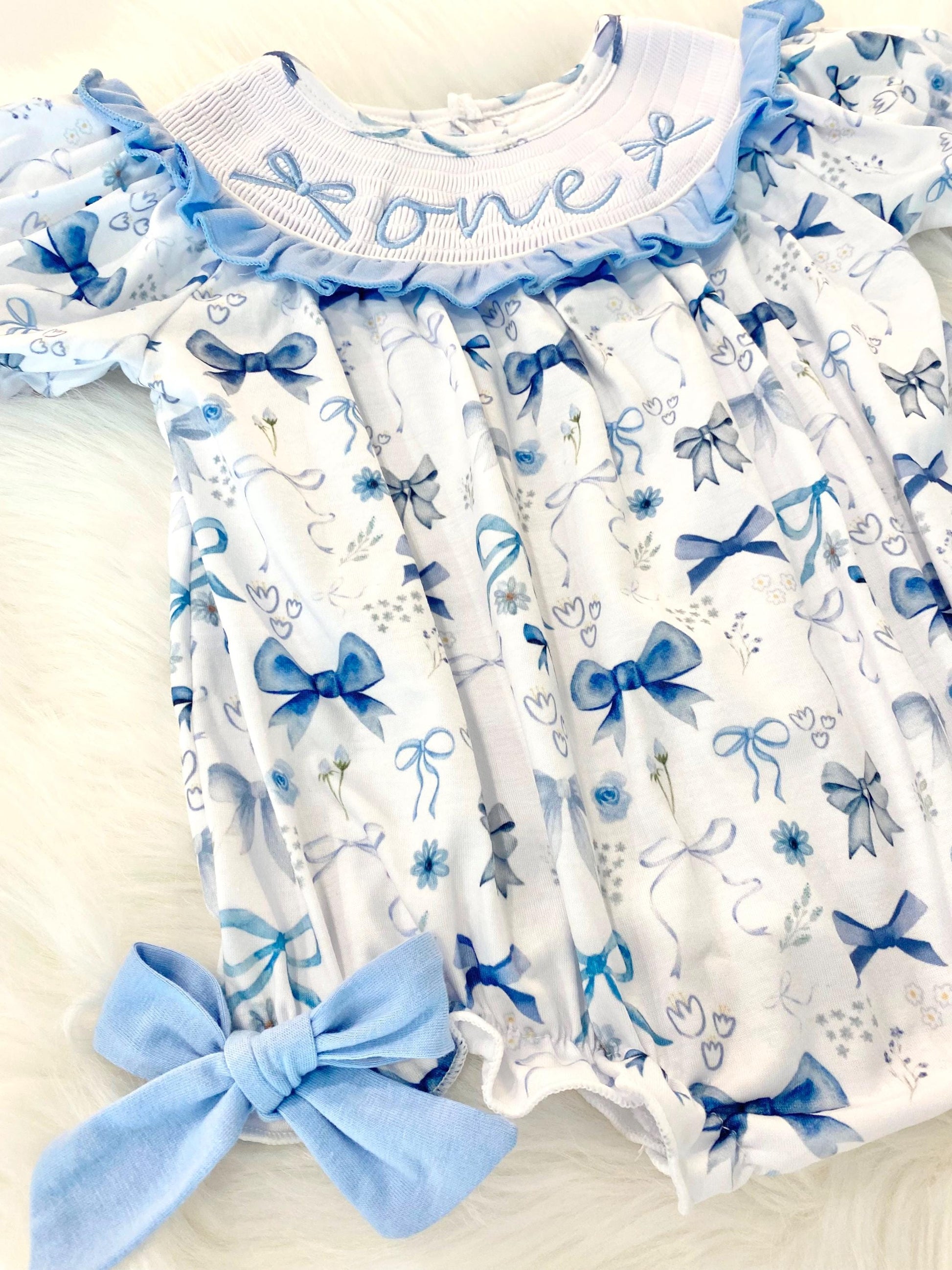blue bow first birthday girl romper pink and white outfit, girls just want to be one blue white smocked bubble romper first birthday winter bows ruffle bows  embroidered smocked short sleeve 1st birthday outfit romper baby girls