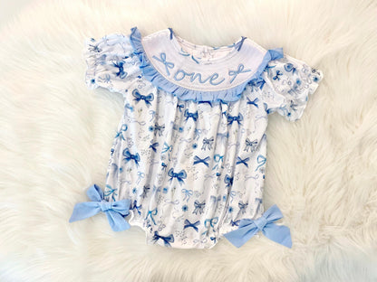 blue bow first birthday girl romper blue and white outfit navy blue blueberry, coquette love shack fancy one bubble girls just want to be one little candle smocked bubble romper first birthday winter bows ruffle bows embroidered smocked short sleeve 1st birthday outfit romper baby girls, 4th of july summer blue and white flowers floral, patriotic boy girl twins, the mod mango baby boutique co