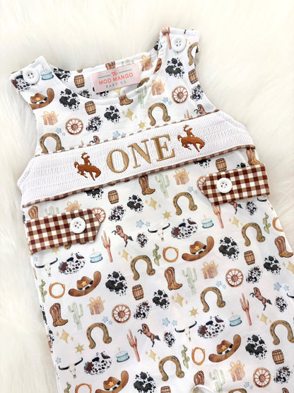 my first rodeo birthday boy romper cowboy western shortalls brown tan beige white gingham smash cake outfit overalls, ONE smocked romper first birthday cowboy, rodeo western cowboy embroidered smocked spring summer fall 1st birthday boy outfit romper baby boys rodeo 1st birthday