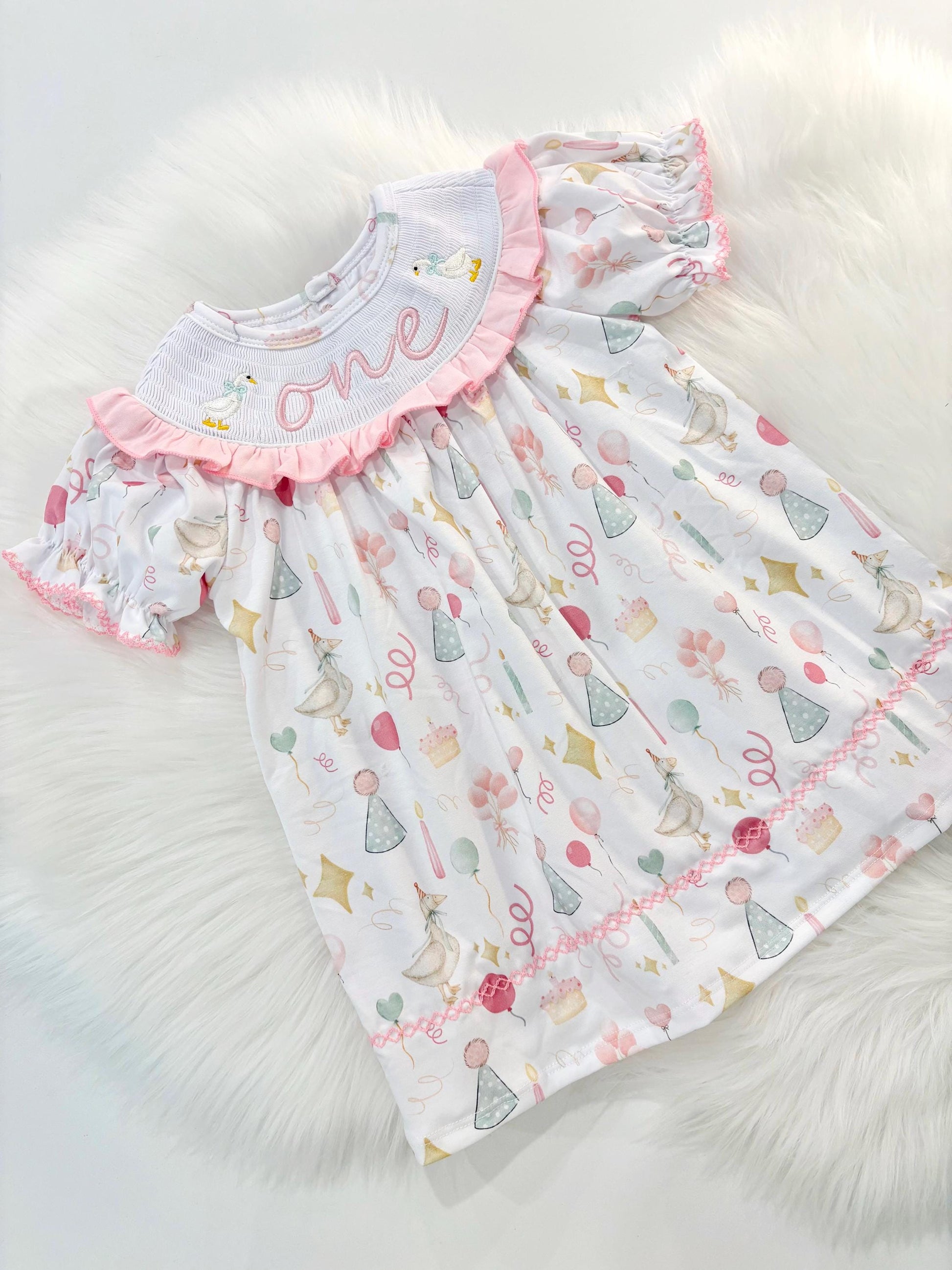 ONE Silly Goose First Birthday Girl Smocked Ruffle Dress The Mod Mango Baby Co. ONE Silly Goose First Birthday Girl Smocked Ruffle Dress The Mod Mango Baby Co.