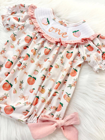 one sweet peach girls first birthday bubble romper outfit peachy blush pink bows first birthday girl romper peach and white outfit, peach smocked dress first birthday embroidered peaches smocked short sleeve 1st birthday outfit ruffle bubble romper baby girls