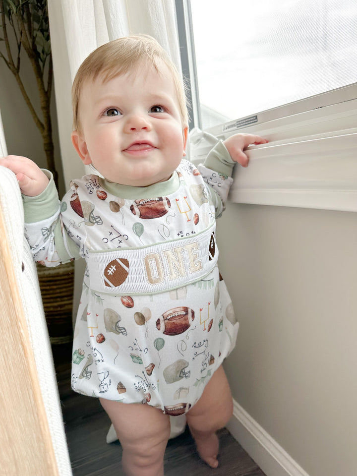 football first birthday shirt outfit romper first year down football shirt boy romper fall green brown tan beige outfit, ONE smocked bubble romper first birthday footballs, party sports embroidered smocked 1st birthday outfit romper baby boys