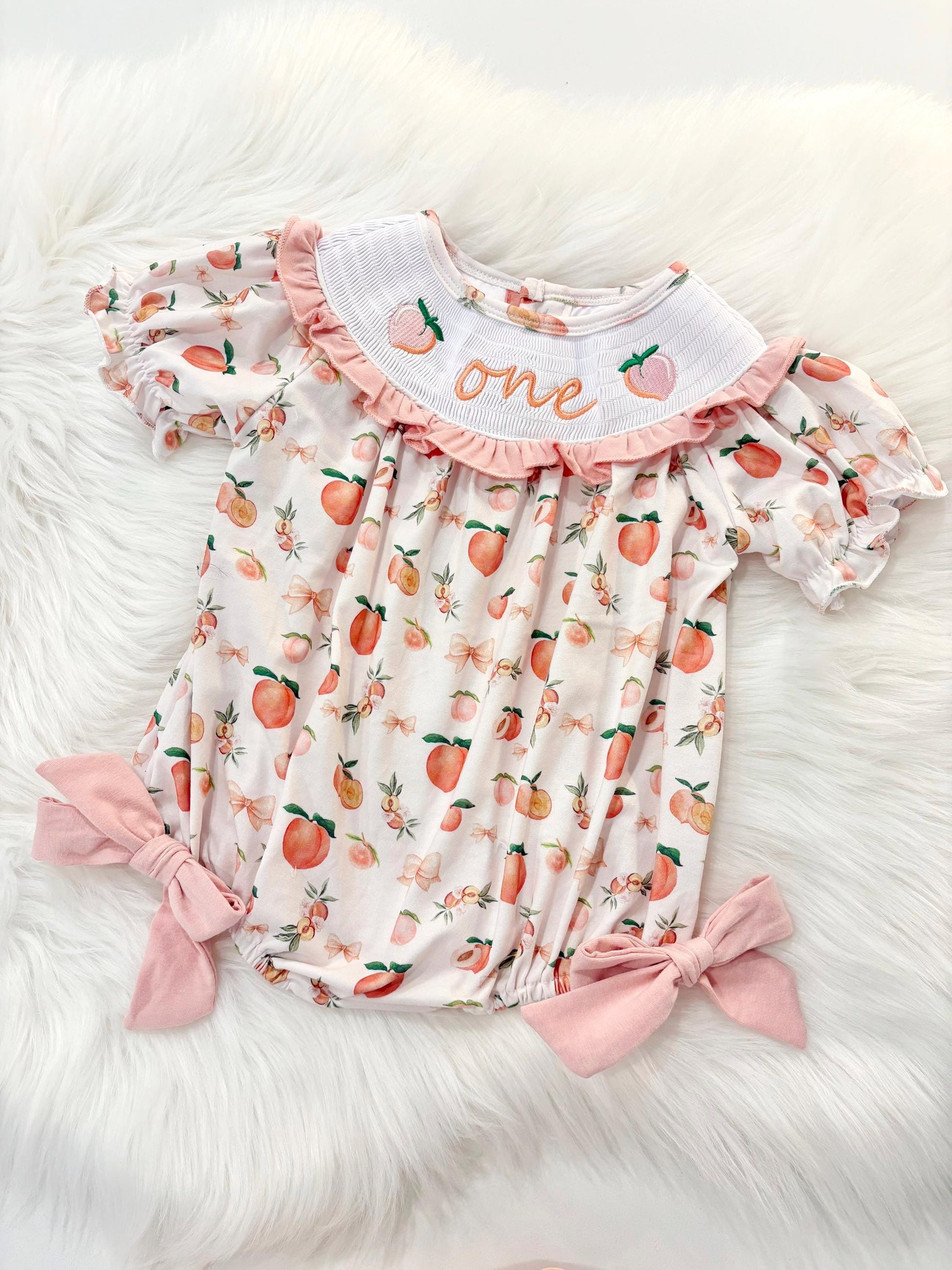 one sweet peach girls first birthday bubble romper outfit peachy blush pink bows first birthday girl romper peach and white outfit, peach smocked dress first birthday embroidered peaches smocked short sleeve 1st birthday outfit ruffle bubble romper baby girls