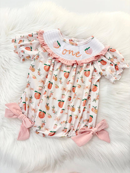 one sweet peach girls first birthday bubble romper outfit peachy blush pink bows first birthday girl romper peach and white outfit, peach smocked dress first birthday embroidered peaches smocked short sleeve 1st birthday outfit ruffle bubble romper baby girls