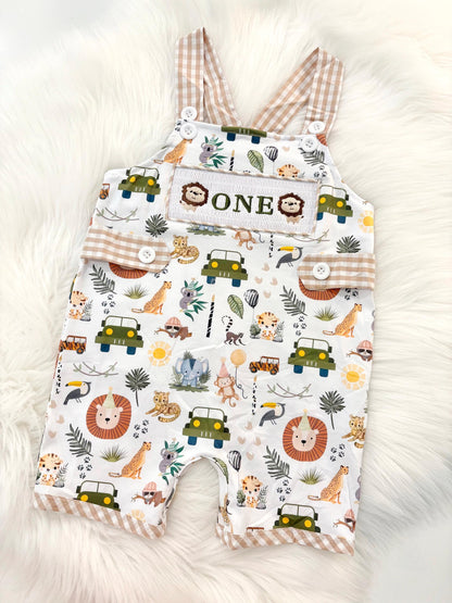 wild one safari first birthday boy romper camping hunter green white gingham tan beige brown smash cake outfit overalls, ONE smocked romper first birthday wild one safari, animals lion embroidered smocked spring summer 1st birthday boy outfit romper baby boys cake smash outfit, the mod mango baby boutique co