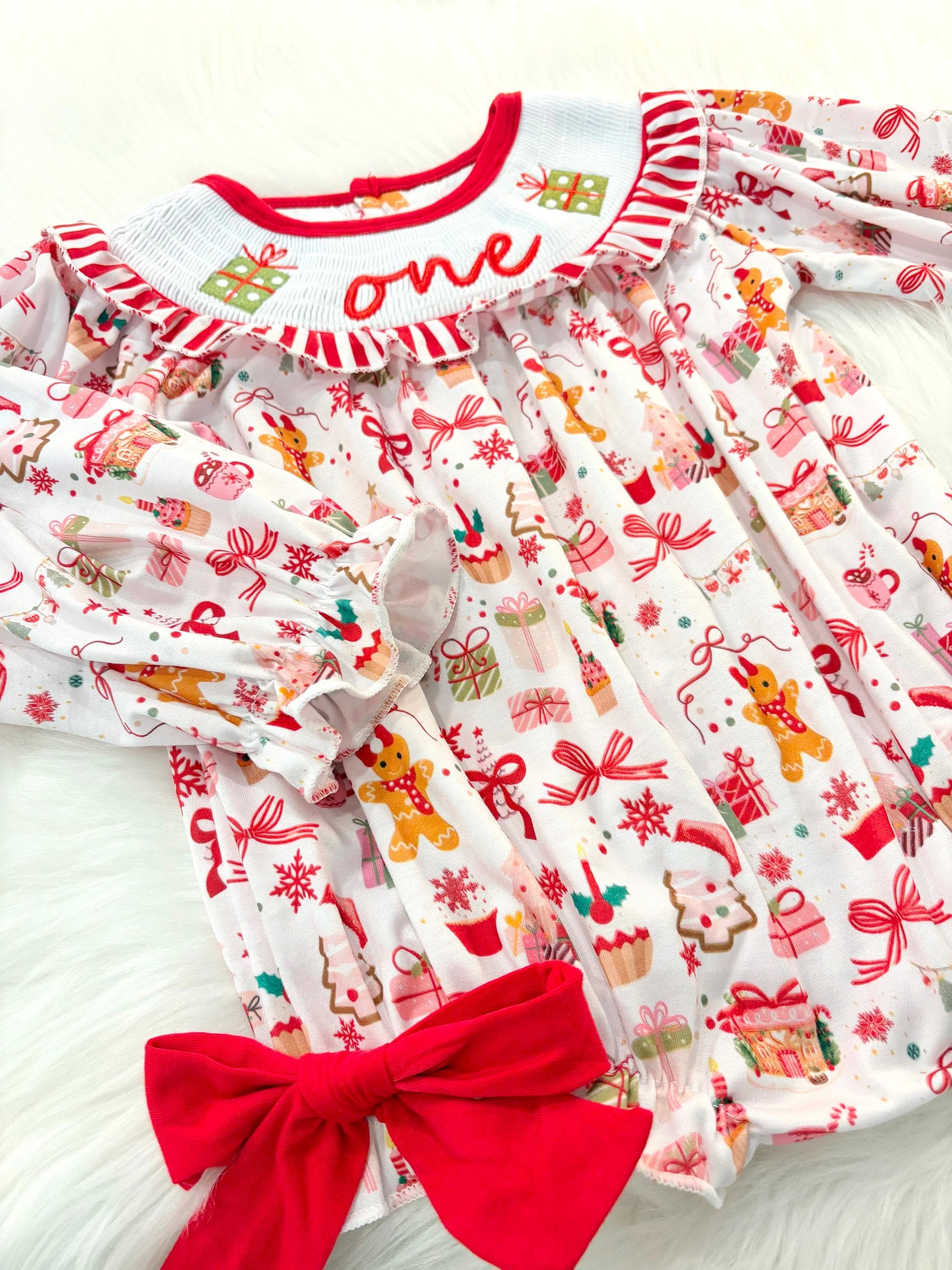 red christmas bow oh what fun it is to be one first birthday girl romper red green white pink outfit, red and white striped stripes ruffle smocked bubble romper first birthday holiday christmas ruffle bows embroidered smocked long sleeve 1st birthday outfit romper baby girls, the mod mango, the mod mango baby co baby boutique