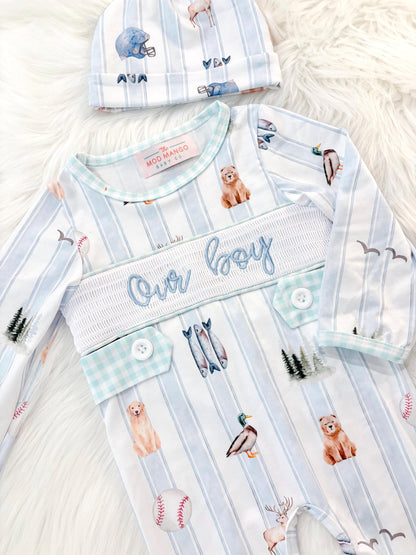 newborn boys baby blue and white smocked baby romper outfit bodysuit and knotted hat with stripes and boy hunting for baby, fish buck deer bear football sports baseball mallard duck puppy dog pine trees outdoor all american boy, our boy monogram baby shower gift for boy, light blue and mint green gingham baby gift, newborn coming home outfit, baby shower gift set, pregnancy announcement, custom newborn baby romper outfit, boutique smocked baby gift set, the mod mango baby boutique co