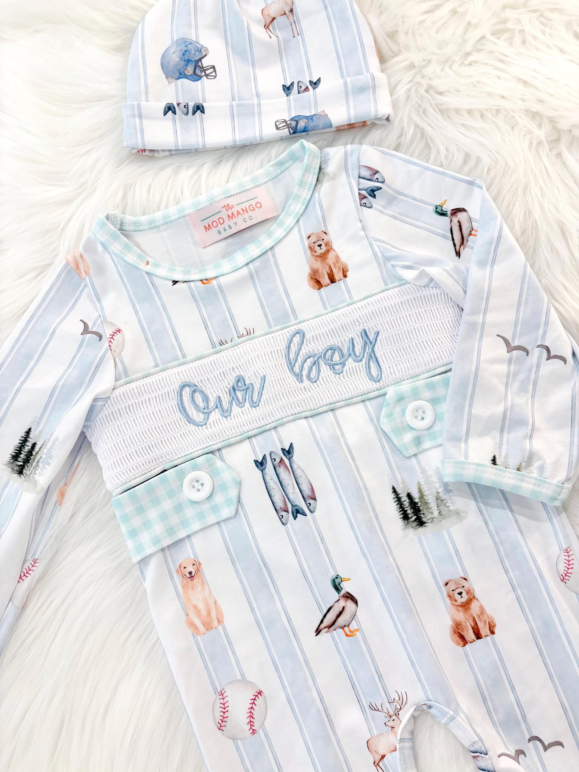 newborn boys baby blue and white smocked baby romper outfit bodysuit and knotted hat with stripes and boy hunting for baby, fish buck deer bear football sports baseball mallard duck puppy dog pine trees outdoor all american boy, our boy monogram baby shower gift for boy, light blue and mint green gingham baby gift, newborn coming home outfit, baby shower gift set, pregnancy announcement, custom newborn baby romper outfit, boutique smocked baby gift set, the mod mango baby boutique co
