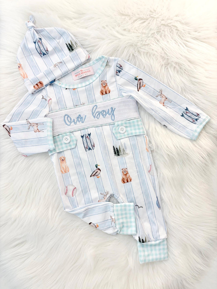 newborn boys baby blue and white smocked baby romper outfit bodysuit and knotted hat with stripes and boy hunting for baby, fish buck deer bear football sports baseball mallard duck puppy dog pine trees outdoor all american boy, our boy monogram baby shower gift for boy, light blue and mint green gingham baby gift, newborn coming home outfit, baby shower gift set, pregnancy announcement, custom newborn baby romper outfit, boutique smocked baby gift set, the mod mango baby boutique co