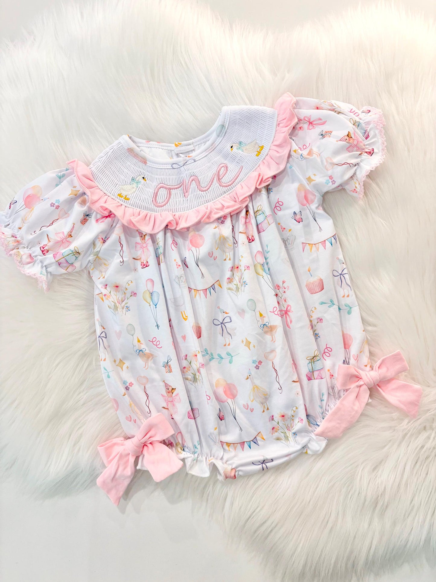 one silly goose girls first birthday bubble romper outfit pink bows first birthday girl romper pink and white outfit, pink sage green smocked dress first birthday embroidered  goose smocked short sleeve 1st birthday outfit ruffle dress baby girls