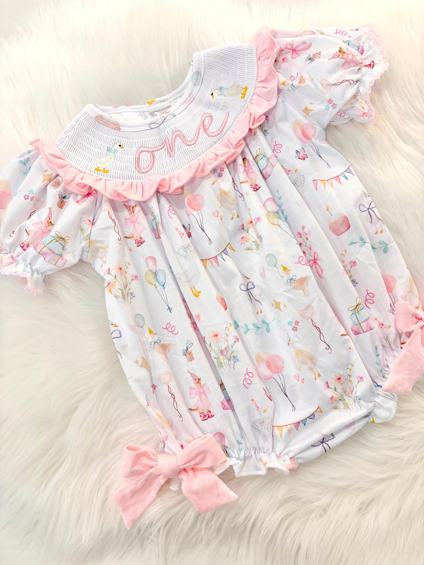 one silly goose girls first birthday bubble romper outfit pink bows first birthday girl romper pink and white outfit, pink sage green smocked dress first birthday embroidered  goose smocked short sleeve 1st birthday outfit ruffle dress baby girls