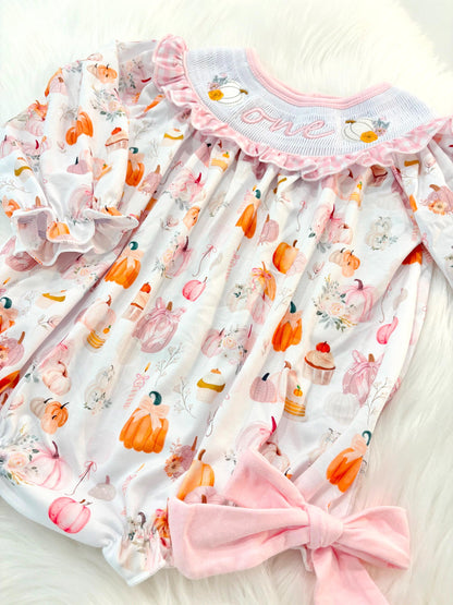 pink pumpkin bow first birthday girl romper blush pink orange floral and white outfit, pink and white gingham smocked bubble romper first birthday fall pumpkins ruffle bows embroidered smocked long sleeve 1st birthday outfit romper baby girls, the mod mango, the mod mango baby co baby boutique