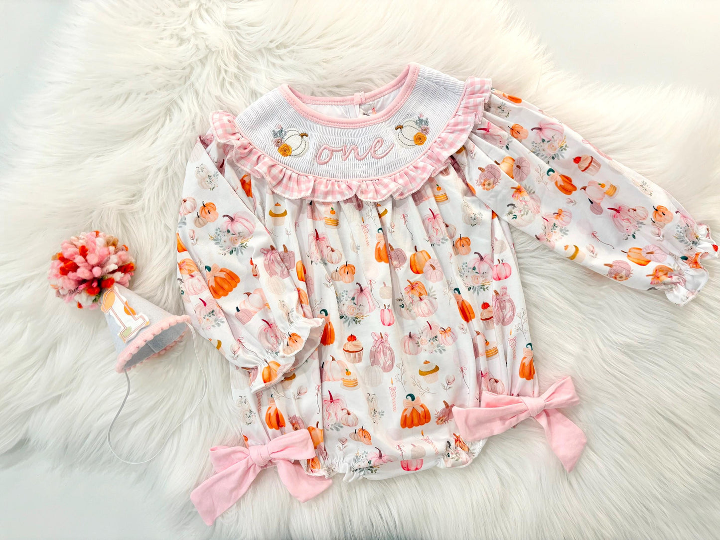 pink pumpkin bow first birthday girl romper blush pink orange floral and white outfit, pink and white gingham smocked bubble romper first birthday fall pumpkins ruffle bows embroidered smocked long sleeve 1st birthday outfit romper baby girls, the mod mango, the mod mango baby co baby boutique