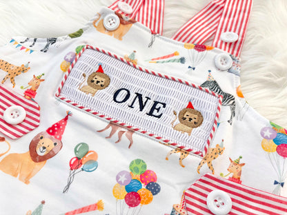 carnival circus party animal cake smash outfit first birthday boy romper 1st birthday red  and white striped stripes colorful smash cake outfit overalls, ONE smocked romper first birthday, animals lion embroidered smocked spring summer 1st birthday boy outfit romper baby boys cake smash outfit, the mod mango baby boutique co