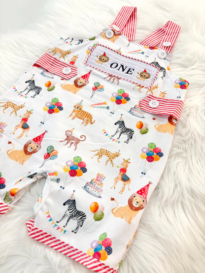 carnival circus party animal cake smash outfit first birthday boy romper 1st birthday red  and white striped stripes colorful smash cake outfit overalls, ONE smocked romper first birthday, animals lion embroidered smocked spring summer 1st birthday boy outfit romper baby boys cake smash outfit, the mod mango baby boutique co